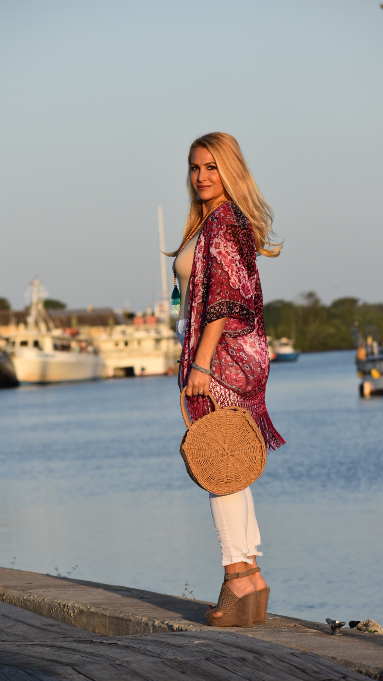 Beach Kimono, White Distressed Jeans, Tassel Necklace and Round Straw Handbag in Tarpon Springs Florida