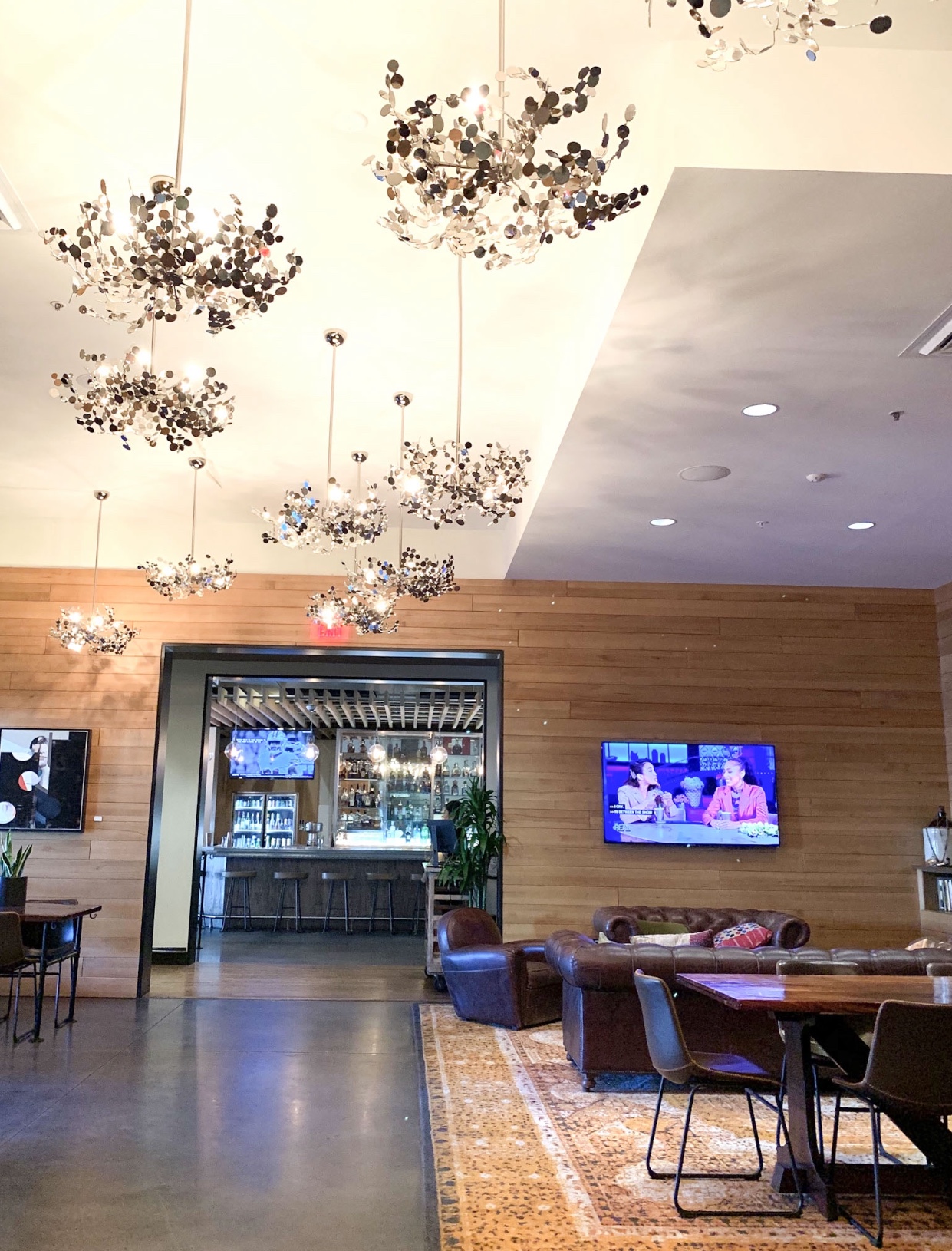 The lobby lounge and chandeliers at the Epicurean Hotel, Autograph Collection 1207 S Howard Ave, Tampa, FL 33606