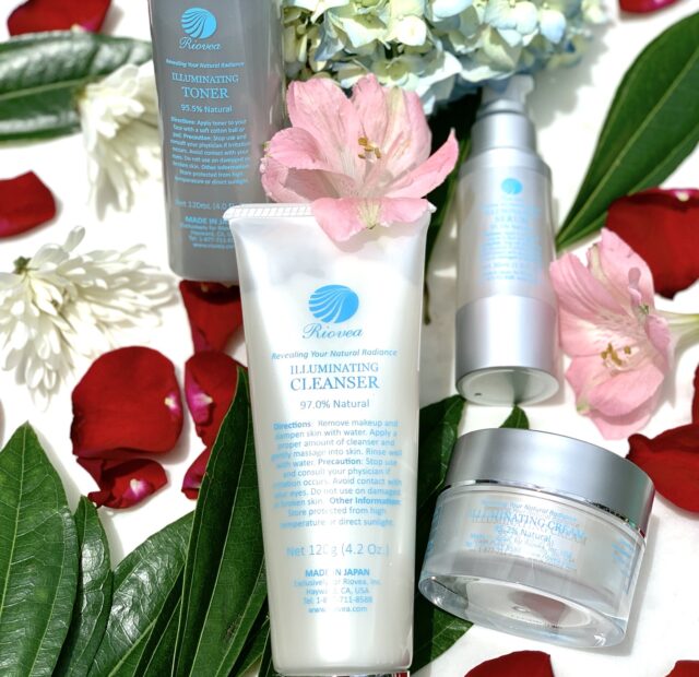 Skincare products with flowers and leaves display.